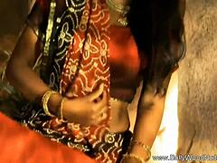 A beautiful brunette milf from Bollywood India dances solo in high definition, captivating her friend with graceful moves.