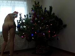 petite amateur dances by christmas tree