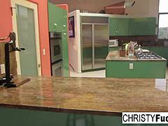 Hey, check out sexy Christy Mack teasing her huge tits and juicy pussy on that kitchen counter! 🍑🔥