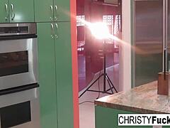 Hey, check out sexy Christy Mack teasing her huge tits and juicy pussy on that kitchen counter! 🍑🔥