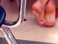 playful latina teases with her soles in the classroom setting.