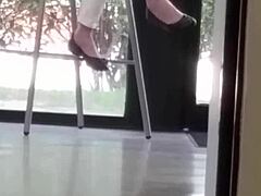 mature woman engages in shoe play with feet and shoes