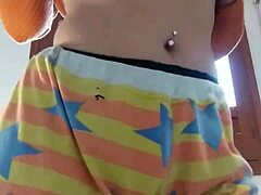 Girlfriend performs home striptease, revealing ass and natural tits