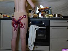 Wow! Naked housewife with octopus tattoo cooks in kitchen ignoring everyone!