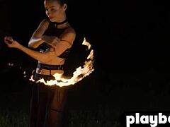 Elilith Noir's Seductive Striptease With Fire In The Dark