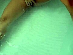 The sexy pornstar masturbates in the hydro massage bathtub, moaning as she touches her boobs and cock!
