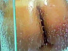 Why is the husband filming his naked wife in the shower? Look at her big juicy tits!