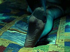 Perfect toes teasing in sexy fishnet stockings.