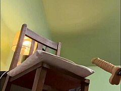 alikat2, the transsexual, plays with dildo on oak chair