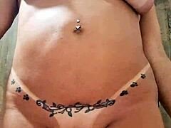 Milf plays with dildo in naked pussy.