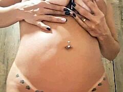 Milf plays with dildo in naked pussy.