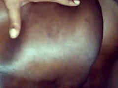 Intimate moments on the couch during a passionate encounter.