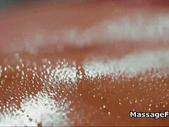 Beautiful blonde masseuse seduces cute housewife on massage table