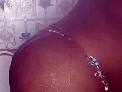 Thick ebony woman fucks and dances in the shower