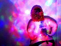 Plump redhead BBW strips naked, ripping clothes in oily dance