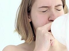 Young Looner Babe Blowing and Popping Her First Balloon with Flair.