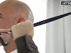 Sexy chick in black lingerie sucking passionately.