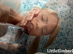 Little blonde Kimberly teases herself with a dildo toy for fun.