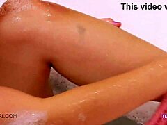 Brunette teen flaunts perfect body in bath