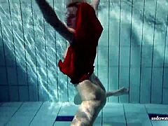 Russian Teen Lucie Swimming Underwater in Pool.