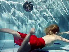 Russian Teen Lucie Swimming Underwater in Pool.