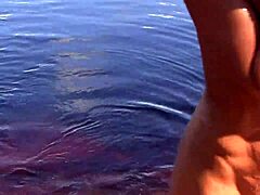 Naked redhead teen seduces with water lily in outdoor play