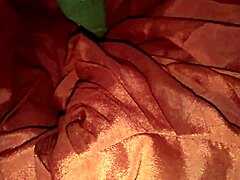Horny Indian bisexual shemale masturbates in red silk satin