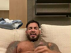 Tatued Viktor Rom with huge cock teases in bathroom striptease
