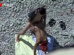 beach voyeur catches curvy milf giving head and taking it doggystyle in public with tan lines.