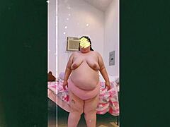 Mature woman dances topless on webcam