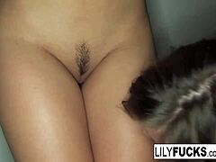 Dressed in black lingerie, Lily and Dani Daniels engage in playful interaction with each other.