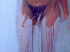 college tanned gorgeous girl feels relaxed taking a shower in her bikini