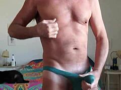 Pervy papifachero was playing with his big daddy boner bulge in his turquoise thong and just rubbing his frenum in the s