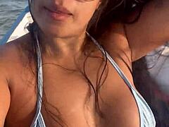 brazilian latina wife rides in bikini on boat