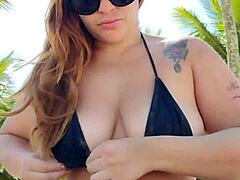 She wears a short bikini to the beach