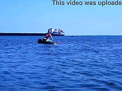 Mature woman in bikini on Volga River boat