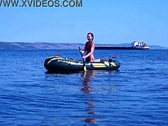 Mature woman in bikini on Volga River boat