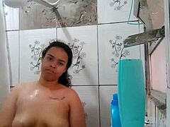 Gorgeous Latina brunette shows off her wet pussy while taking a shower