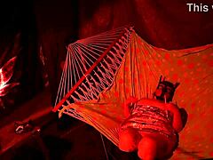 getting frisky in a tent fingering her wet hole in a hammock