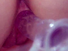 Natural busty redhead feels deep emotions during solo masturbation with clear dildo close up