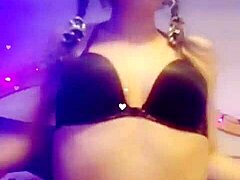 Seductive babe smokes cigarette while performing slow striptease, ripping clothes off provocatively