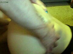 Girlfriend kneels for oral sex in front of the desk.