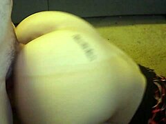 Girlfriend kneels for oral sex in front of the desk.