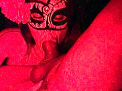 Masked in red light, this Latina gives a deep homemade blowjob on that cock
