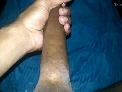 Feeling so aroused while stroking my massive black cock alone at home.