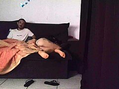 Stepmother shares living room sofa with stepson in cozy family home setting during evening relaxation