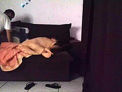 Stepmother shares living room sofa with stepson in cozy family home setting during evening relaxation