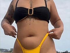 i wore a tight yellow bikini to show off my swollen pussy at the beach