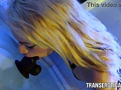 trans blonde sasha de sade is licking dildos while jerking off her huge cock