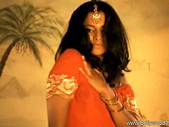 this indian milf strips down in a teasing dance, slowly undressing her brunette body for an erotic nude show with softcore vibes